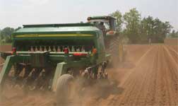 photo showing the drill planter from the rear and in action