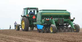 photo of the tractor and planter in motion