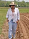 photo of SBR Project PI Saratha Kumudini in field during May 2008 planting