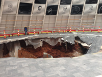 The size of the hole in the Skydome floor becomes evident when people stand near it.