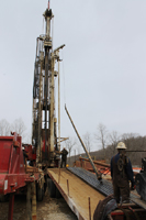 A drilling joint just pulled out of the well is laid down as another core is brought to the surface on April 4.