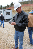 Rick Bowersox, of the KGS Energy and Minerals Section, examines the piece of Nolichucky core.