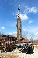 A view of the drilling rig and casing for the well as the drilling got underway.