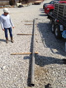 A thirty-foot long core, just pulled from deep in the well on April 1, with the core still inside.