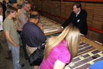 John Hickman of the Energy and Minerals Section answers questions about cores displayed in a core characterization and analysis session.