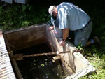 Glynn Beck preparing to sample a domestic spring in Breckinridge County.