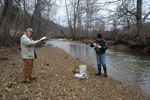 Steve Webb and Bart Davidson taking a sample from Grassy Creek in Carter County prior to installation of the Carter County Test Well.