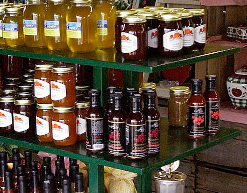 Value-added products including honey and jams on display.