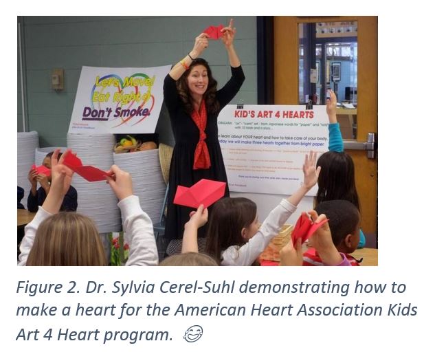 Figure 2. Dr. Sylvia Cerel-Suhl demonstrating how to make a heart for the American Heart Association Kids Art 4 Heart program. 