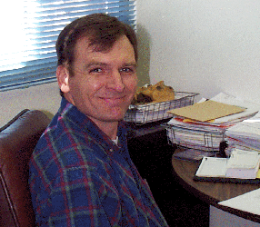 picture of Dr. Bruce Webb sitting in his office