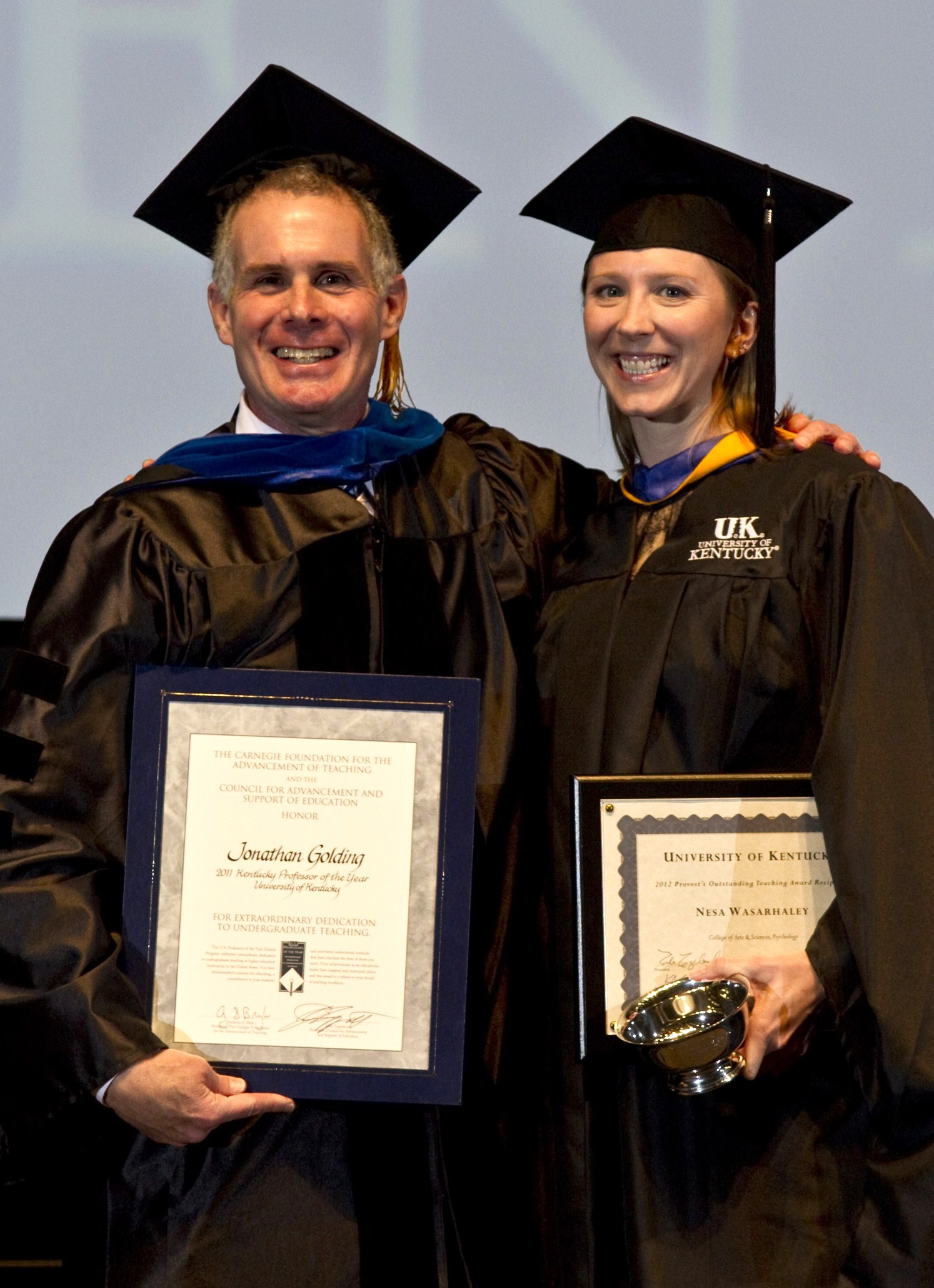 image of Dr. Golding and Nesa Wasarhaley with teaching awards on Founders Day 2012