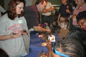 Jamee holding a tarantula at an Insect Expo