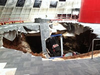 The vintage cars fell through the concrete floor early on the morning of February 12.