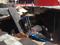 Several of the cars were piled on top of each other and the floor debris.