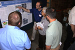 KGS student worker Ralph Bandy describes his poster during the annual seminar.
