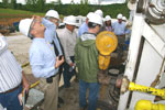 Indiana State Geologist John C. Steinmetz looks up at the drill rig during the site tour.