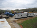 The site was getting crowded with equipment and vehicles as the drill rig was set up