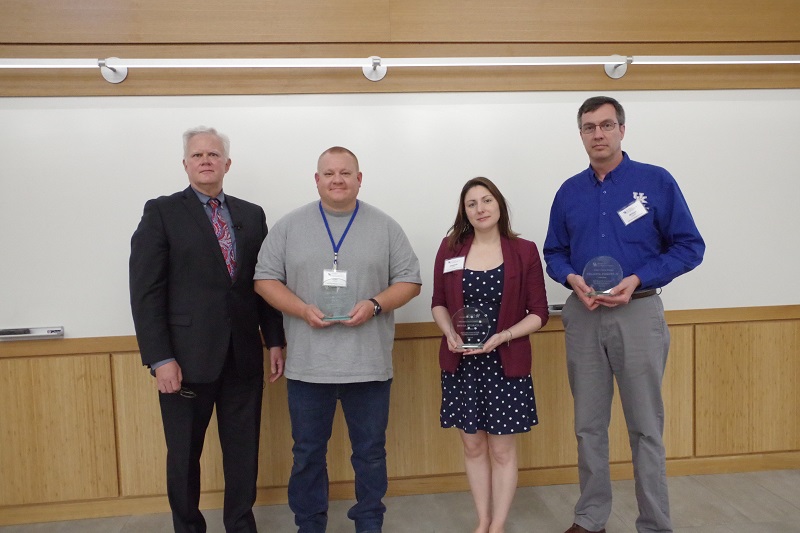 During his State of the Survey address, Director Bill Haneberg presented the first Director's Awards to Ryan Pinkston, Liz Adams, William Andrews, and Ray Daniel (not pictured).