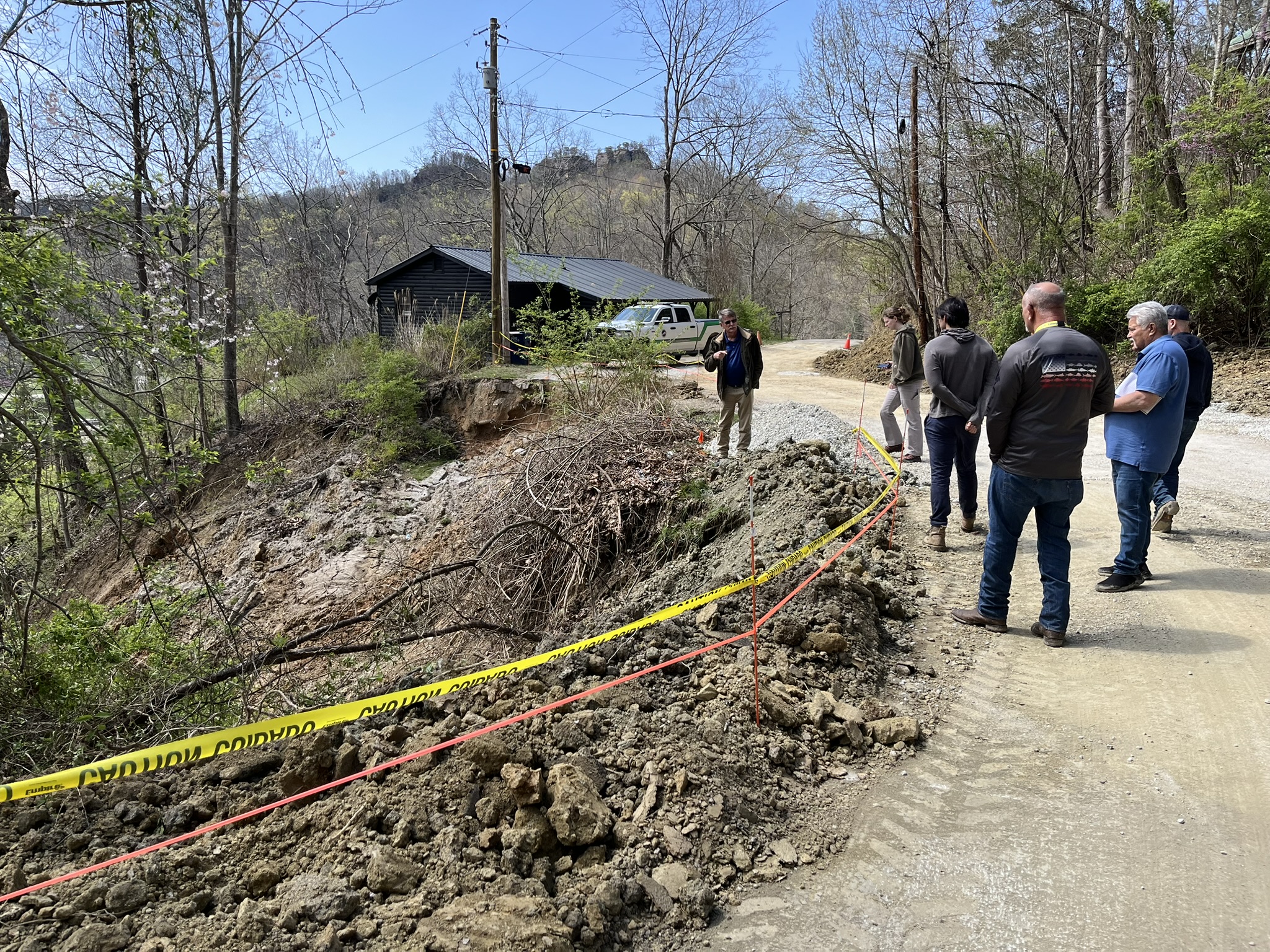 KGS Landslide and Engineering Geology Team responds to a landslide that impacted a road above a business in Slade, Powell County