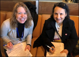 Sarah Arpin talks with Dr. Pat Kambesis from Western Kentucky University as they complete the judge evaluation forms.