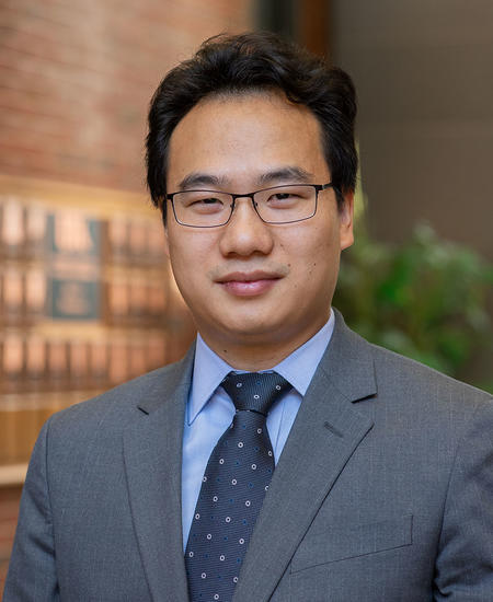 professional headshot of Caigang Zhu