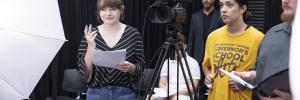 students with camera in acting class