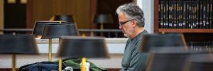 Man working in library.