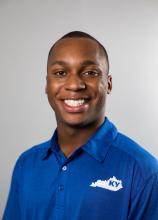 headshot of man in blue polo with state of Kentucky on the front of the shirt