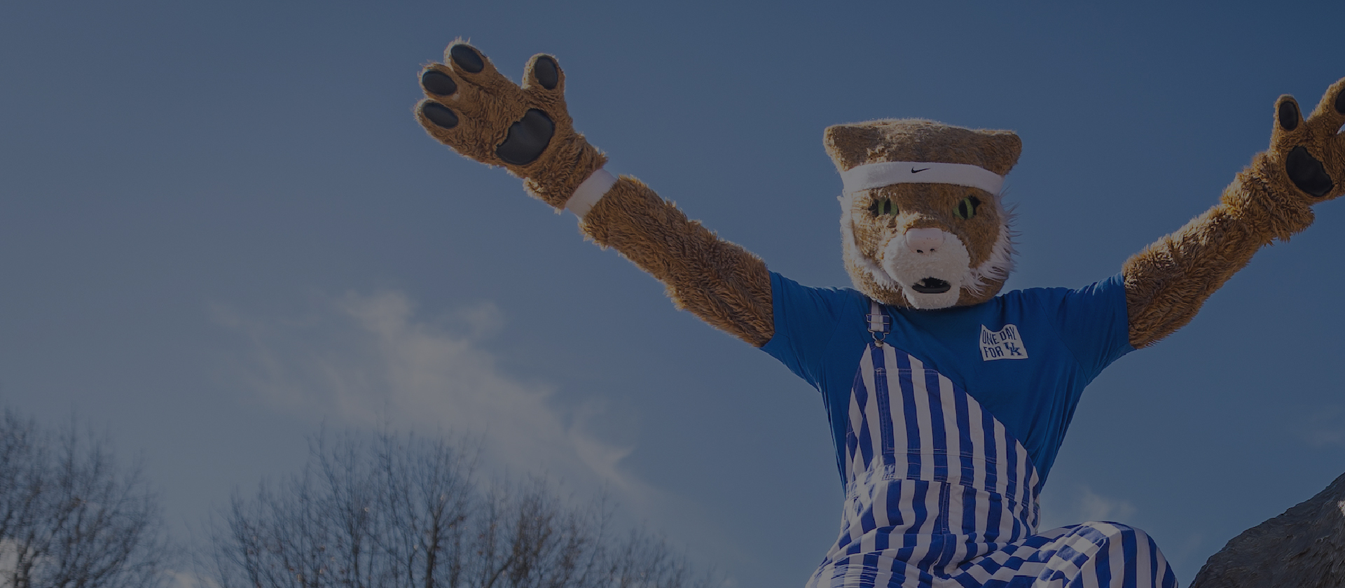 Kentucky Mascot with arms raised in a Y