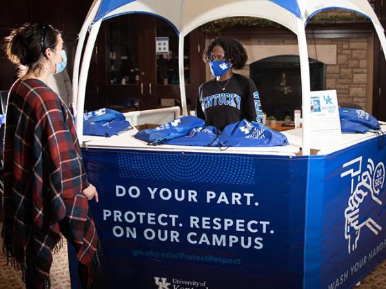 Student Getting Information from UK Wellness Booth