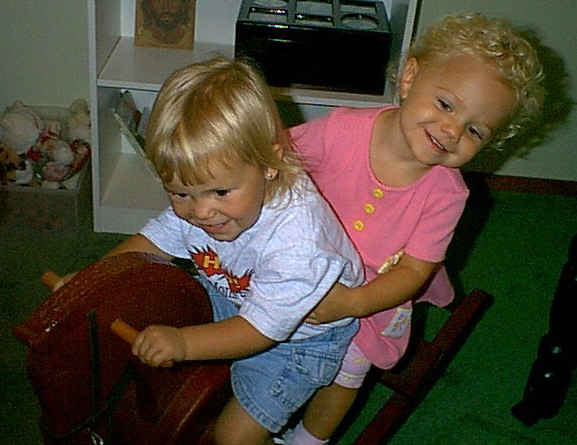 Delaney and Megan on the rocking horse