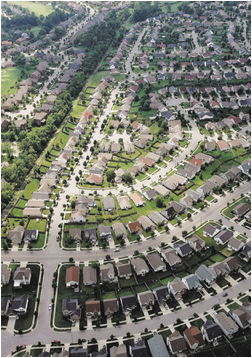 exington's sprawling neighborhoods mean a less dense population center and more traffic, two big factors in its carbon footprint. 2006 file photo by Charles Bertram | Staff